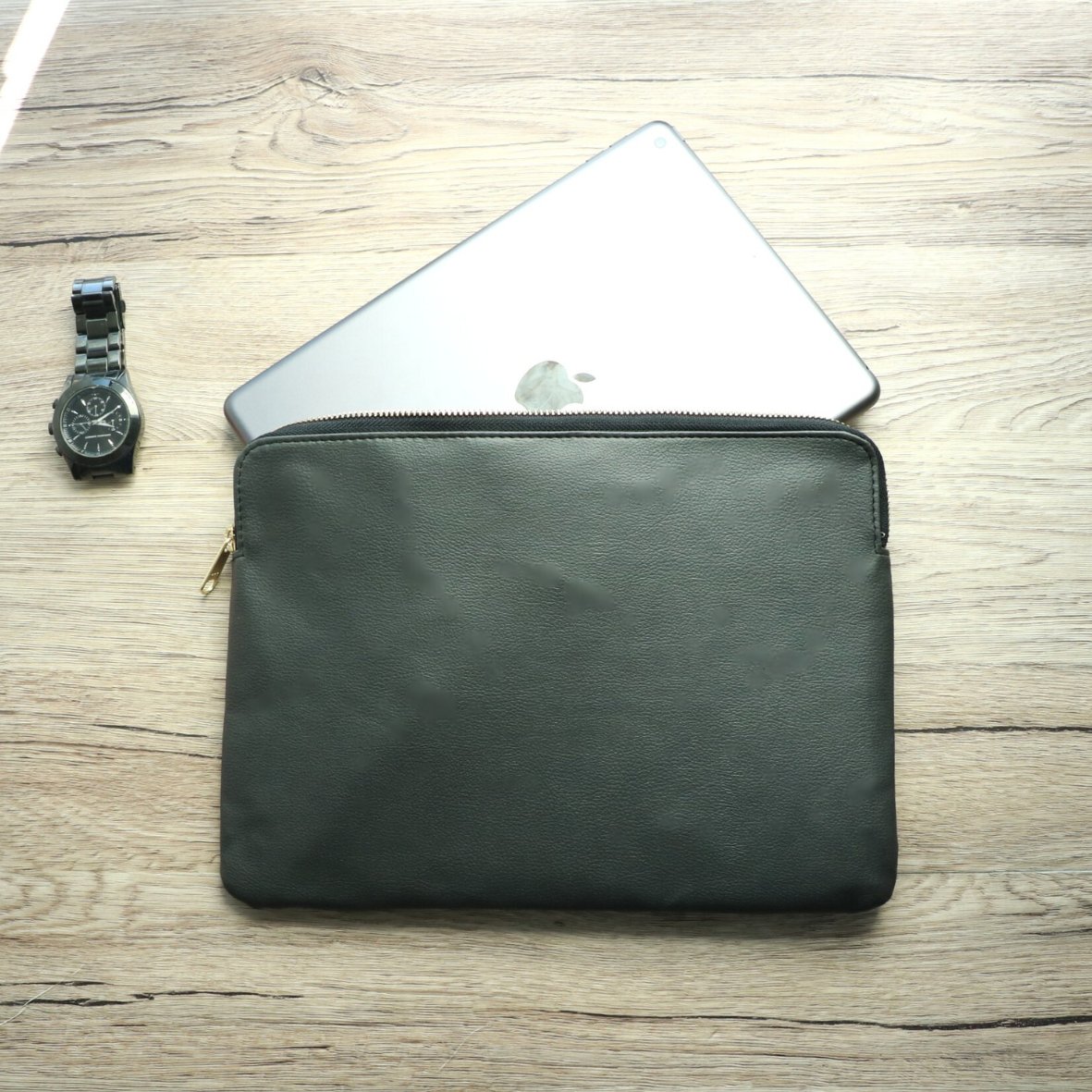Front view of black leather travel bag with zipper for men