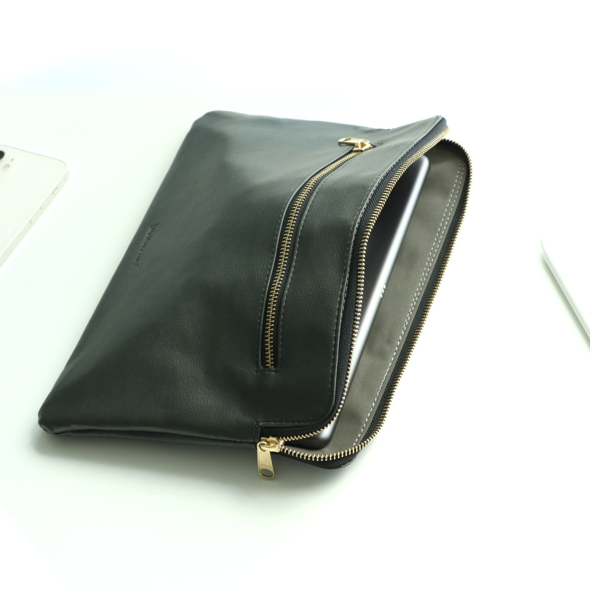 Tablet sleeve open showing soft interior and secure zipper