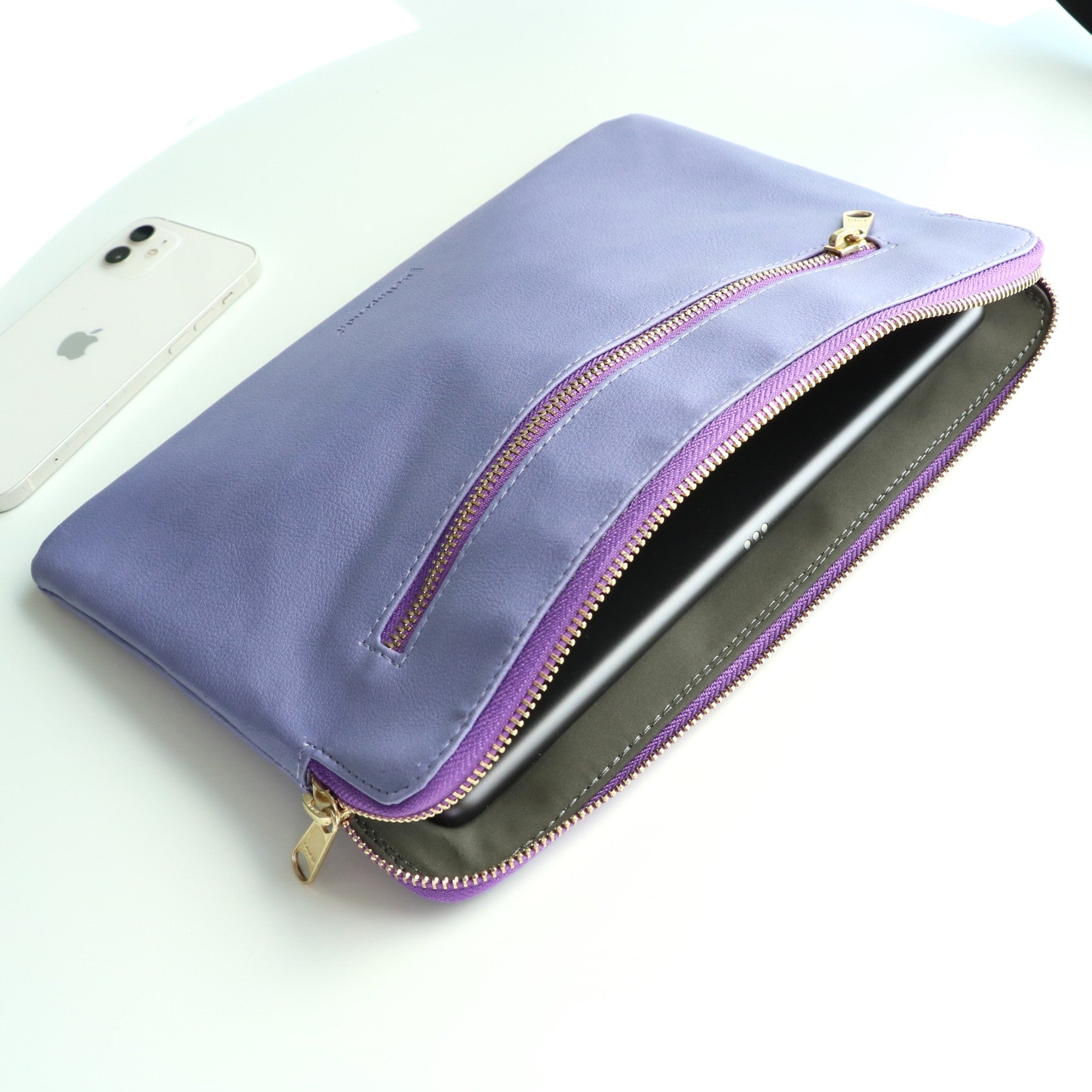 Tablet sleeve open showing soft interior and secure zipper