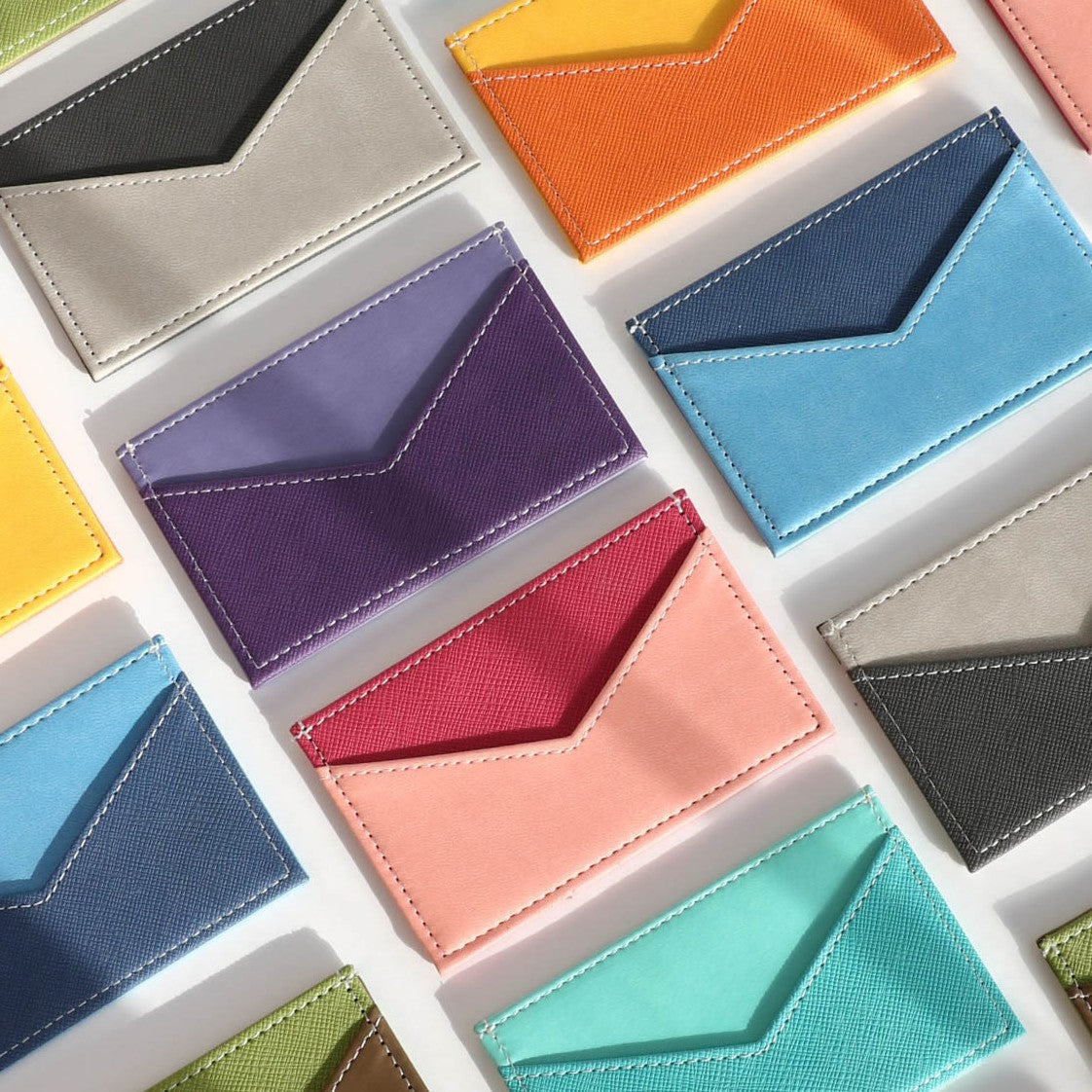 Variety of Slim Leather Card Holder colours including purple, pink, blue, black, green, yellow and ocean.